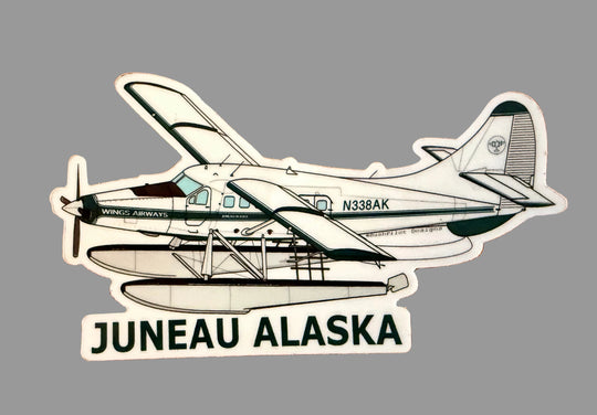 A die-cut sticker of a vintage seaplane labeled 'JUNEAU ALASKA' with the registration N338AK.