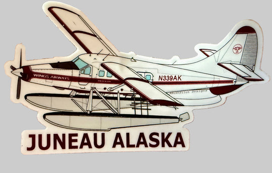 A die-cut sticker featuring an illustrated seaplane , Red N339AK with the text 'JUNEAU ALASKA' below the plane.